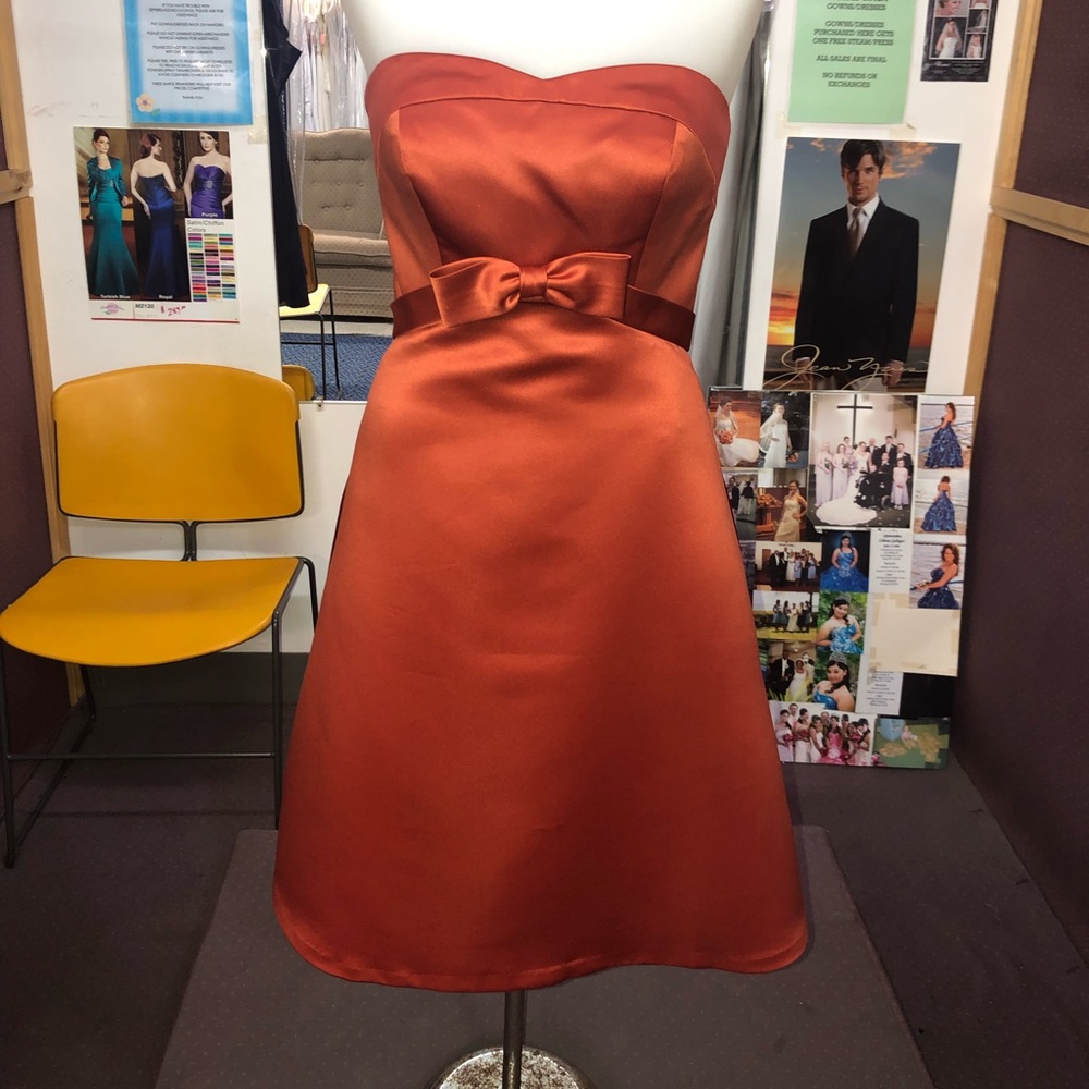 Burnt orange strapless dress with bow detail
